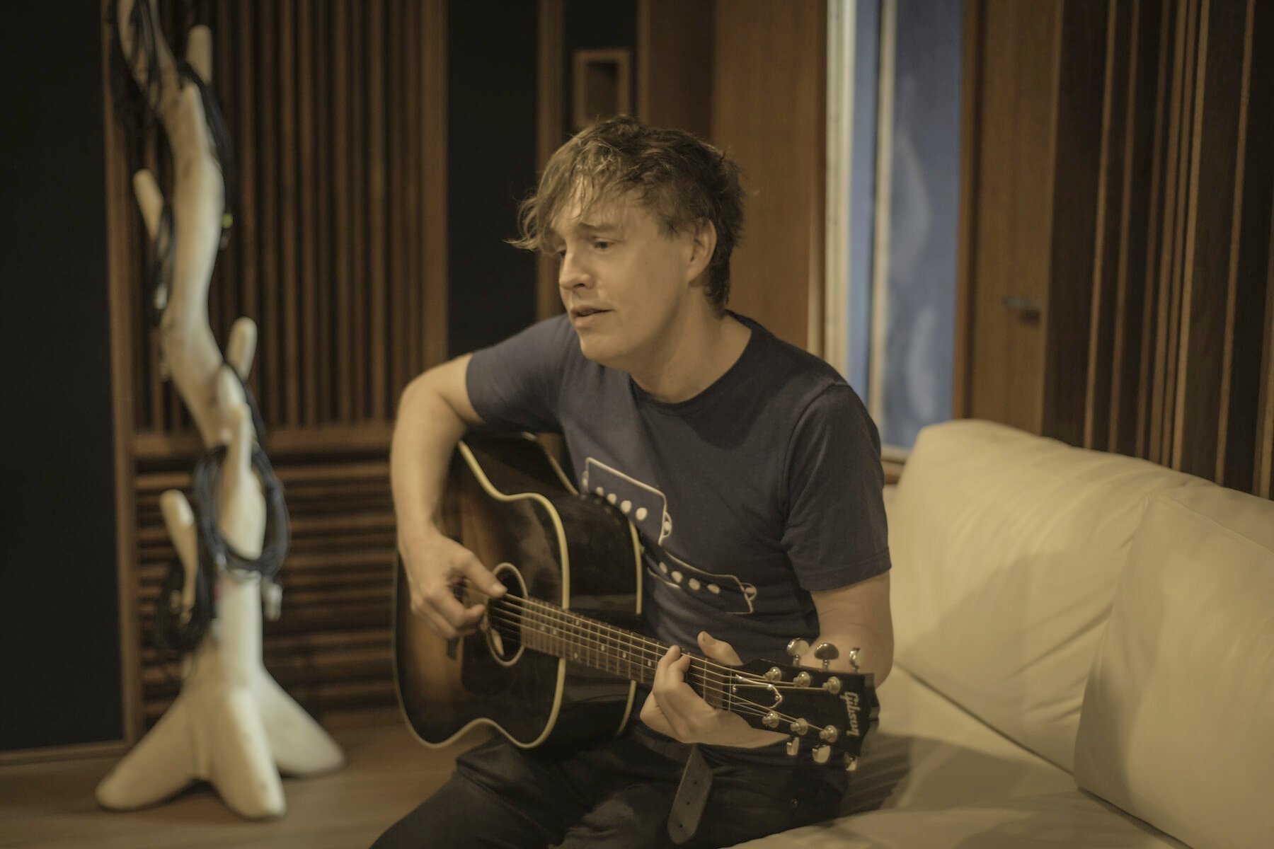 David playing acoustic guitar in the live room