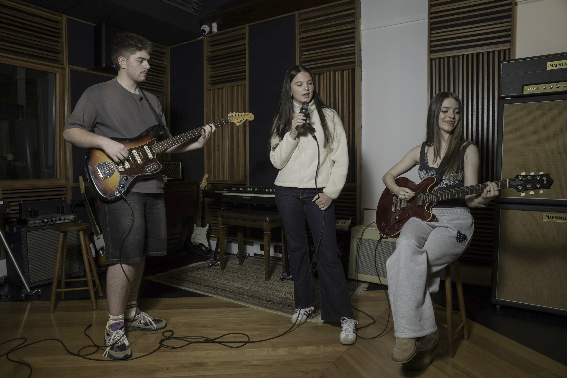 Students performing together in the live room at South Creek Recording Studio