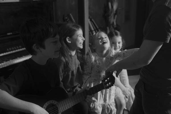 Students laughing together during a band rehearsal