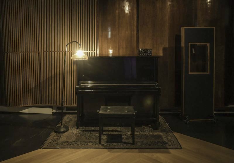 Upright piano and floor lamp in the live room