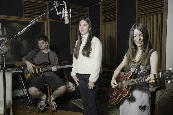 A teen band rehearsing in the live room